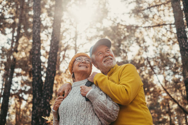 Active older couple smiling on a nature walk